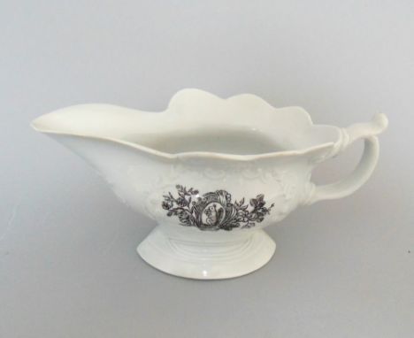 A Worcester sauce boat, primitive printed with a squirrel, a pheasant and inside a milking scene, circa 1755, 19cm including 
