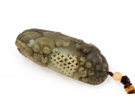 A Chinese jade type pendant, reticulated ovoid with fish in a scrolling seascape, 10.5cm long