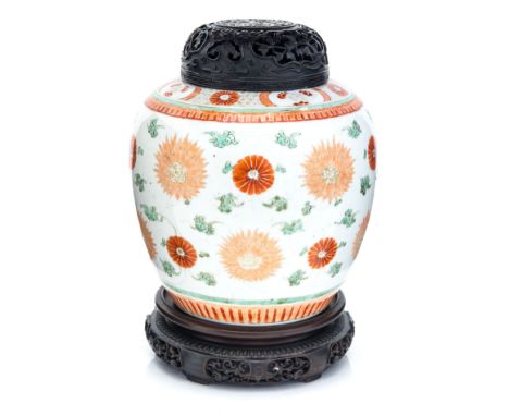 A Chinese Famille Verte ginger jar with jade inset hardwood cover, possibly Kangxi, 18th century, ovoid form painted with a f