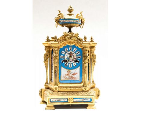 A late 19th Century French ormolu bracket clock, circa 1870, of Baroque design with an urn finial, inset blue Sevres style po