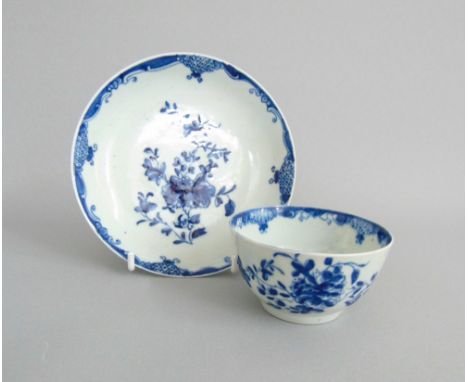 A Worcester blue and white tea bowl and saucer, painted floral sprays, circa 1760, tea bowl 7.2cm diameter, 4.3cm high, sauce