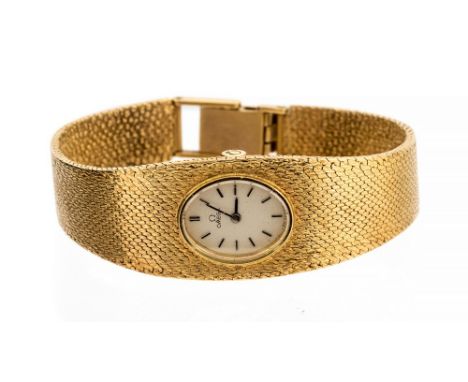 Omega, a circa 1960s/70s ladies 9ct gold Omega bracelet wristwatch, 1.2cm oval silvered dial with baton numerals, integral 9c