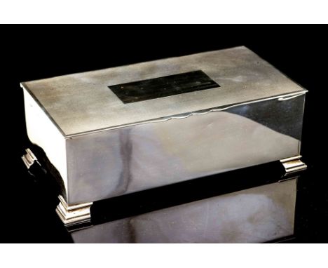 A George VI silver cigarette case, plain rectangular on four stepped feet, the hinged cover with engine turned decoration pla