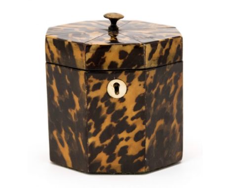 A tortoiseshell octagonal tea caddy, hinged lid, lidded interior, height 13cm