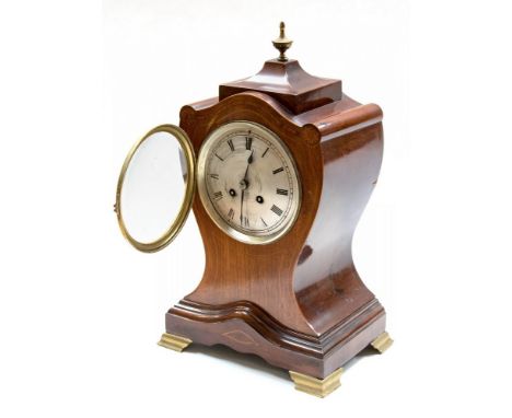 A late 19th Century strung mahogany bracket clock, circa 1890, of balloon form with a caddy top with brass urn finial, silver