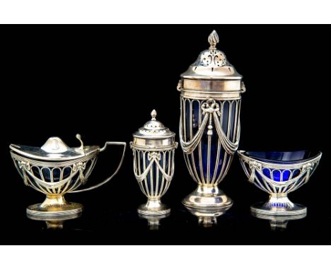 An Edwardian matched set of four Neo-Classical silver condiments including a sugar caster, pepper caster, mustard pot and sal