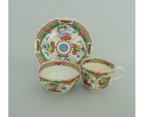 A Worcester faceted trio, decorated with the 'Dragons in Compartments' pattern, circa 1765-70, fret mark, tea bowl  8.4cm dia