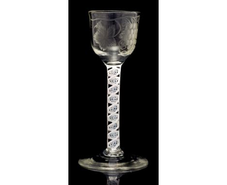 An 18th century opaque twist wine glass, the ogee bowl engraved with vines and bird, on a multi strand and double series heli