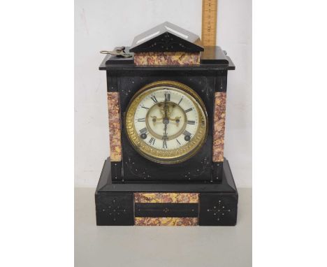 A Victorian black slate and marble mounted mantel clock