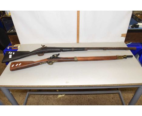 A antique percussion cap musket, probably of Indian manufacture, heavily worn condition together with a reproduction flintloc