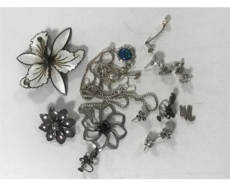 A collection of silver jewellery including a Norwegian enamel flower brooch