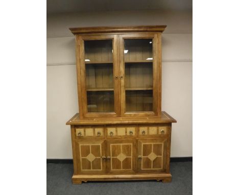 A Barker and Stonehouse Flagstone glazed double door bookcase, fitted with cupboard and three drawers below, width 137cm