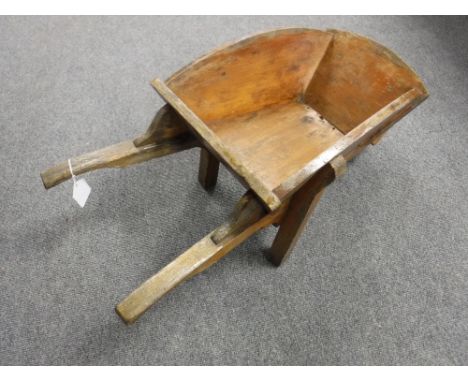 A wooden wheel barrow planter 