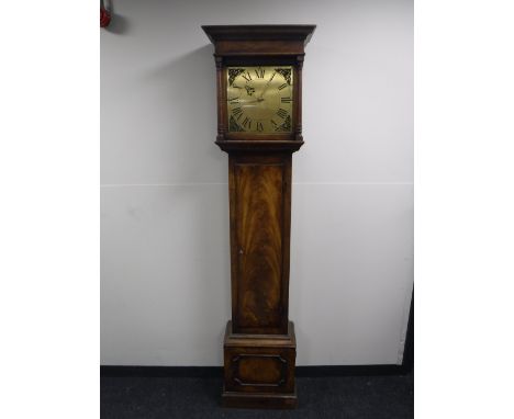 A mahogany longcase clock with brass dial and battery movement