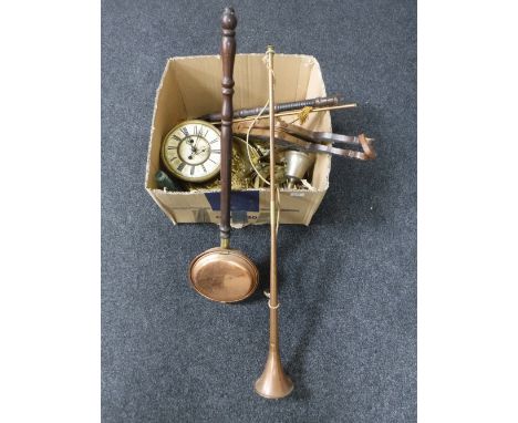 A box containing assorted brassware, clock movement, bellows, copper hunting horn, bed warming pan, ornamental axe 