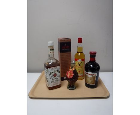 Five bottles of alcohol including Famous Grouse, Stag Royal Canadian Spirit, Isle of Skye Drambuie Aged Scotch Whisky, Jim Be