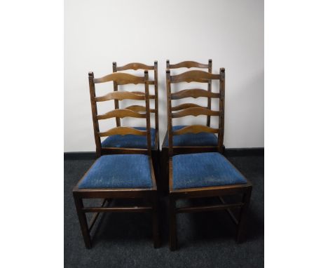 A set of four oak ladder back chairs