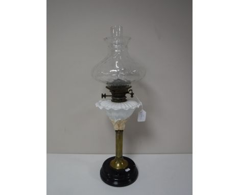 An antique brass and china oil lamp stamped Williams &amp; Bach New Bond Street, London