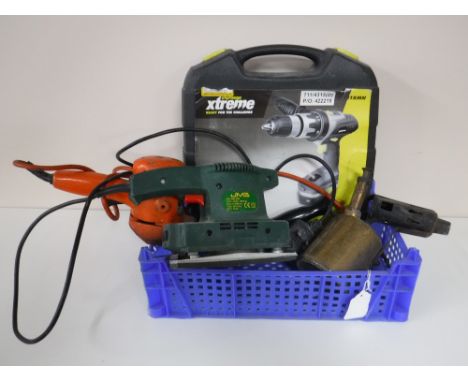 A crate containing a Challenge Extreme Cordless Hammer Drill, electric hedge trimmer, a JMB sander, together with a brass blo