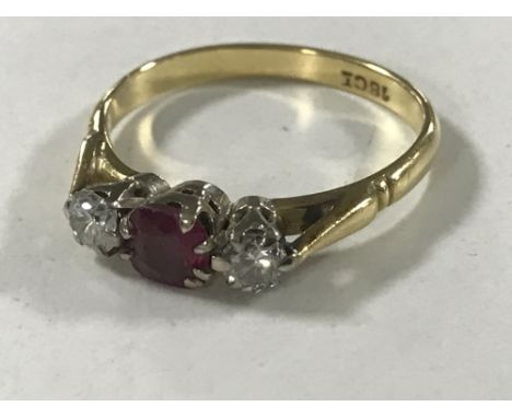 An 18ct gold ruby and two stone diamond ring, size O/P, 3.3g.