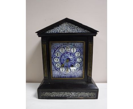 A Victorian ebonised cased mantel clock with blue porcelain dial