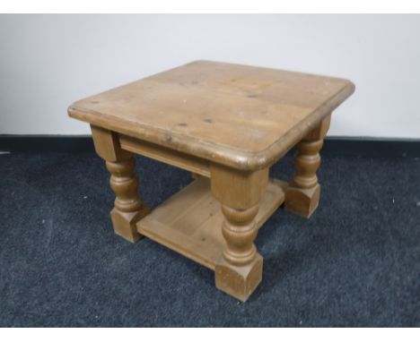 A pine two-tier lamp table
