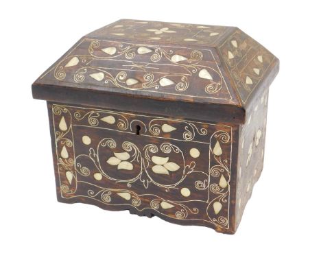 An Eastern hardwood casket, with mother of pearl inlaid decoration, the lid of sloping form, above a square base, 23cm high.