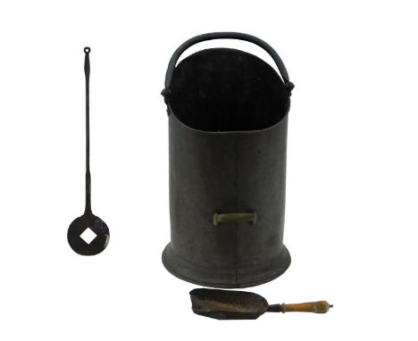 A Victorian copper coal scuttle, of cylindrical form, on a flared foot, with ring handle, 54cm high, together with a wrought 