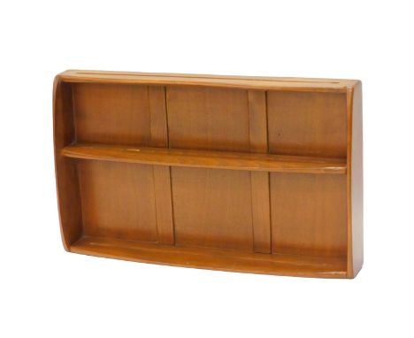 An Ercol elm two tier wall mounting plate rack, 81cm wide. 