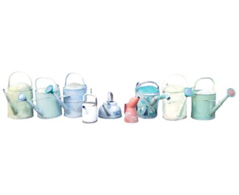 A quantity of painted galvanised watering cans, a Thelson Tractor Oil can, etc.