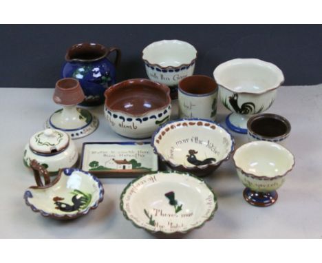 Box of vintage Torquay Motto Ware to include match striker, bowls etc and mainly with Black Cockerel image to the sides