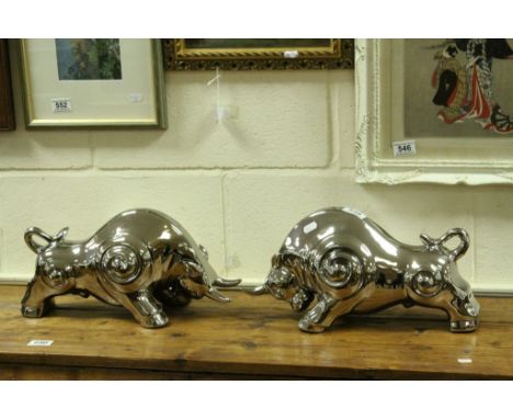 Pair of stylized Ceramic Bulls with reflective silver finish