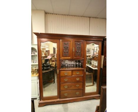 Large Late Victorian Mahogany Compendium Wardrobe comprising of a Central Bank of Two Carved Doors opening to reveal to Linen