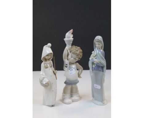 Three Lladro ceramic figurines to include a 1980 Olympic figure with Olympic Torch held aloft