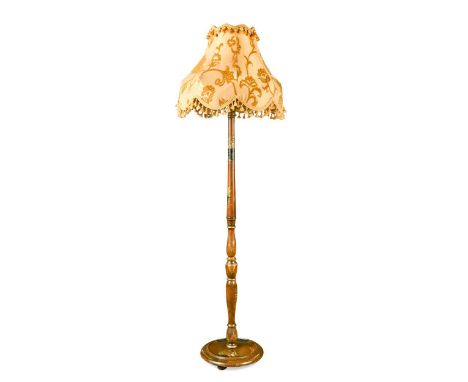 A Chinoiserie decorated standard lamp, circa 1920, of walnut-stained beech construction with gilt and gesso lacquer decoratio