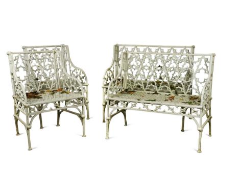 A pair of cast iron garden seats together with a pair of garden chairs, 20th century, of Gothic design, the rectangular pierc