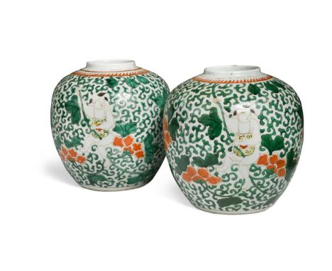 A pair of Chinese famille verte porcelain ginger jars in the Kangxi style, each painted with semi-naked boys riding lotus ste