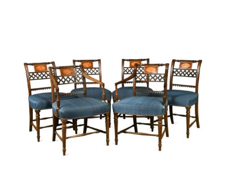 A set of eight mahogany and satinwood inlaid dining chairs, Regency period including one carver of later date, the floral car