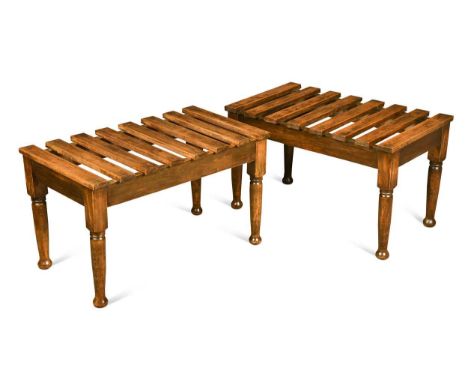 A pair of Edwardian beech and oak luggage stands,  each with slatted tops and raised on turned tapering legs 41 x 70 x 41cm  