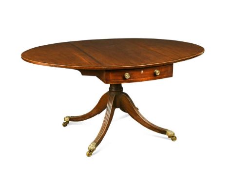 A George III mahogany and fruitwood strung Pembroke table, the oval top with twin dummy end drawers with ivory escutcheons, a