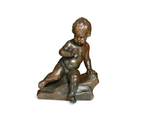 A bronze figure of a putto, 19th century, perched upon a naturalistic base, unsigned16 x 12 x 8cm