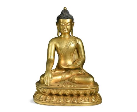 A large Sino-Tibetan gilt bronze Buddha, 20th century, modelled seated with a serene expression, blue colouration to the hair