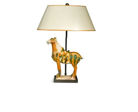 A table lamp mounted with a Tang style horse, modern, the slipware model mounted to a bronzed lamp fitting with oval shade50c