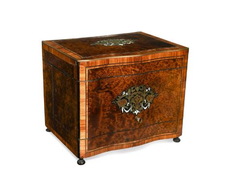 A Napoleon III style amboyna decanter box, 19th century, of serpentine outline, inlaid with decorative brass and ivory motifs