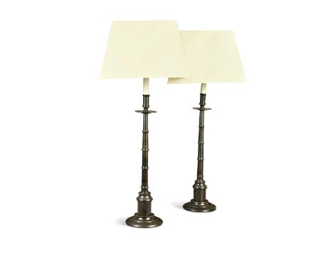 A pair of bronze table lamps, modern, with ring turned tapered columns and stepped circular bases66cm high to fitmentsProvena