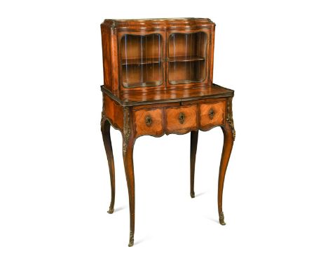 A Louis XV style kingwood parquetry bonheur du jour, decorated with gilt metal mounts, the top section of serpentine form wit