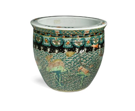 A Chinese famille verte jardiniere, 20th century, painted with eight grotesques against waves27 x 30.5cmsome enamel loss