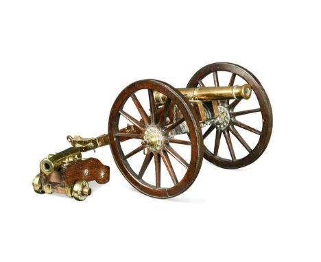 A gilt bronze signalling or saluting cannon, 19th century, the 10.5in barrel to a brass mounted carriage with large spoked wh
