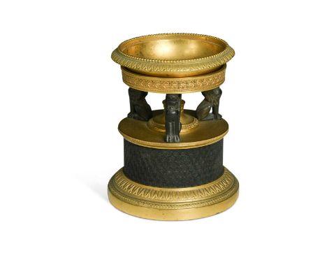 A French Empire bronze and gilt bronze pastille burner, 19th century, the removable bowl on three Sphinx supports and cylindr