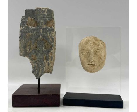 A grey schist-carved architectural fragment of a Boddhisatva beneath a tree, Gandhara, circa 2-3rd century A.D., 17 x 8cm; to